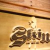 Skin Industries Standing Woman Wood Sign